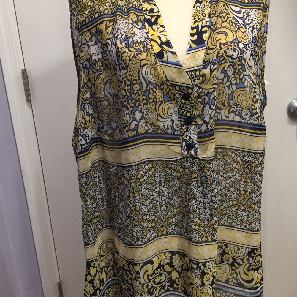 Cute floral blouse with cut out back.
